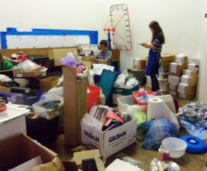 spare parts interns Pak (left) & Annie (right) taking inventory of materials & supplies donations. June, 2013 at St. Paul Gym.